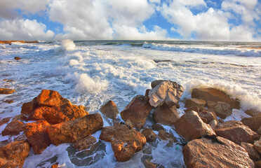 Poster - The waves crash against the rocks