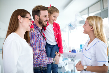 Wall Mural - Family visits dentist in dental office