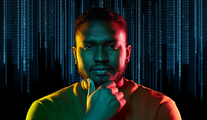 technology, cyberspace and programming concept - portrait of young african american man over binary code numbers on black background