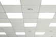 © New Africa - White ceiling with lighting in office room