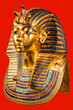Funeral mask of pharoah Tutankhamun on red background