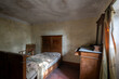 © silvia - Italy, January 20, 2021. Bedroom in an abandoned country villa