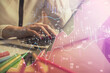 © peshkova - Double exposure of woman hands typing on computer and financial graph hologram drawing. Stock market analysis concept.