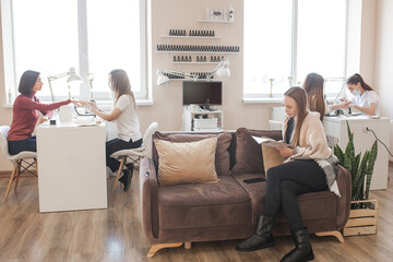 Wall Mural - manicure in beauty salon. woman doing manicure