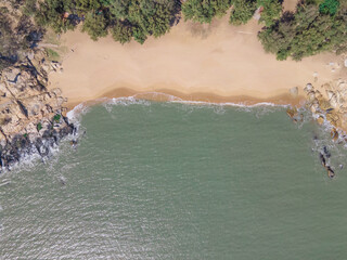 Aerial view of the coastline with rocks.