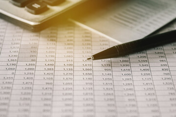 Stack of money coin on accounting sheet with selective focus, Business and financial concept. 