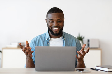 Wall Mural - Web Conference. Cheerful Millennial African American Man Having Video Call On Laptop