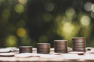 The coins were stacked four, and many coins were lying around.