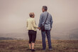 © Vladimir Borovic - Beautiful older couple on mountain top surrounded with fog