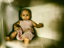 Vintage Wet Plate Photo Of An Old Doll With Added Noise And Antiquing
