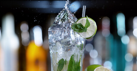 Poster - Detail of glass of mojito drink with splashing liquid
