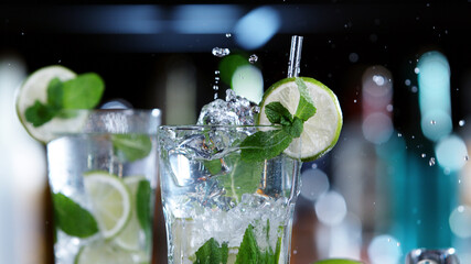 Poster - Detail of glass of mojito drink with splashing liquid