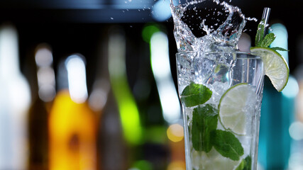 Poster - Detail of glass of mojito drink with splashing liquid