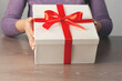 © Alla - woman hand holding gift box