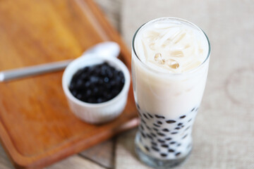 Wall Mural - fresh ice milk tea in the glass with bubble boba and refill boba in the littel bowl 