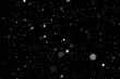 © Niko_Dali - Bokeh of white snow on a black background. Falling snowflakes on night sky background, isolated for post production and overlay in graphic editor.