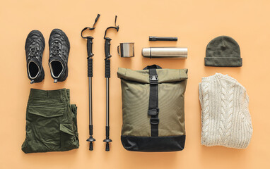 equipment for hiking on color background