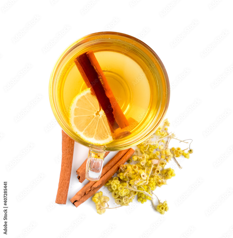Tasty herbal tea with cinnamon and lemon in cup on white background
