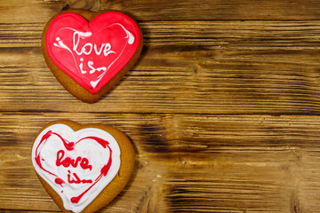 Wall Mural - Heart shaped gingerbread cookies on wooden table.  Top view, copy space. Dessert for valentine day