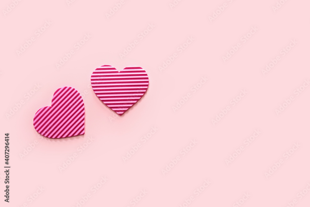 Striped pink hearts on color background