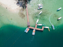 Aerial View Of Tropical Island Sea And Yachts With Wooden Dock On The Green Ocean, Sabah, Malaysia