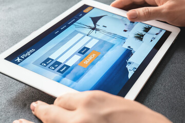 Poster - Woman with tablet computer booking tickets online, closeup