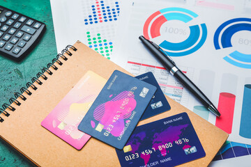 Wall Mural - Credit cards with notebook, documents and calculator on table