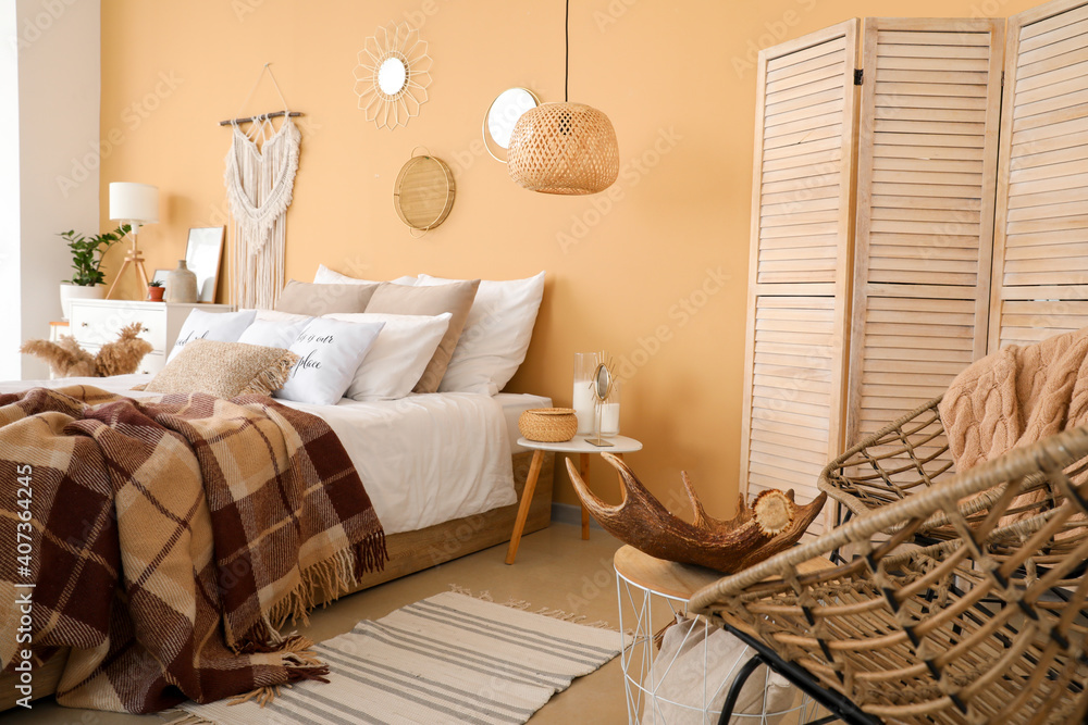 Stylish interior of bedroom with comfortable bed