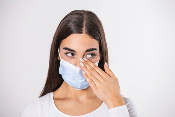 Wall Mural - Don't Touch Your Face. Girl wearing surgical mask rubbing her eye with dirty hands.Precautions, Avoid Touching Your Eyes. Woman in medical mask rubbing her eye