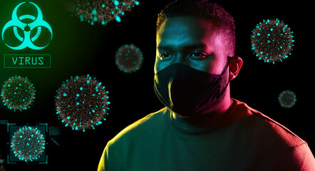 Wall Mural - health, safety and pandemic concept - young african american man wearing reusable protective mask over coronavirus virions on black background