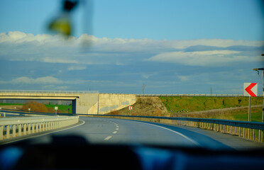 Photo taken from inside the car to highway road.