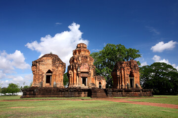 Prasat Sikhoraphum or Castle Rock temple in Surin of Thailand, with beautiful blue sky and clouds background. 