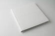 © dyachenkopro - white wedding photo book from white leather on white background