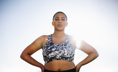 Confident plus size female model in sportswear