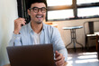 © panitan - asian man work using computer hand typing laptop keyboard contact us.student study learning education online.adult professional people chatting search at office.concept for technology device business