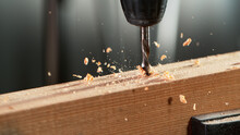 Detail Of Drill Making Hole Into Plywood