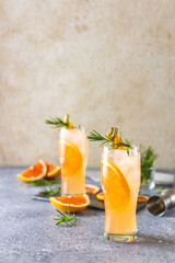 Wall Mural - Paloma cocktail tequila fresh grapefruit juice combined and rosemary. Festive drink is ideal for brunch, parties and holidays.