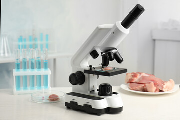 Wall Mural - slide with meat sample on microscope in laboratory. poison detection