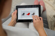 © New Africa - Woman using tablet for online shopping indoors, closeup