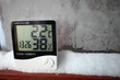The humidity indicator is indicated on a hygrometer installed on the snow. Picture of an electronic device for testing air temperature and humidity.