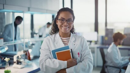 Wall Mural - medical science laboratory: beautiful smart young black scientist wearing white coat and glasses, ho