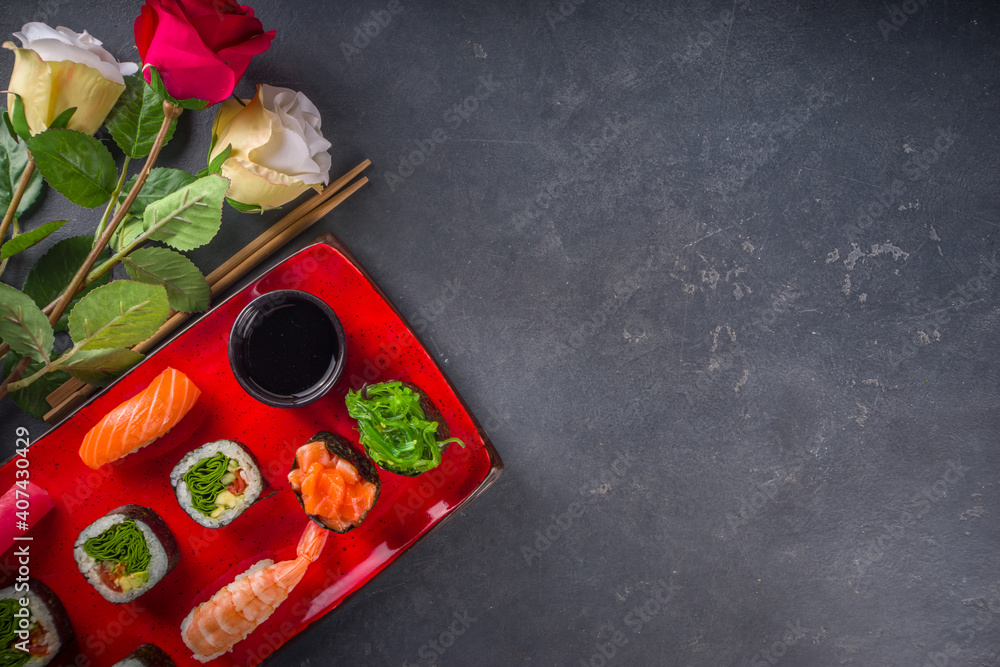 Valentine day festive dinner idea. Menu, invitation background for Valentine day sushi roll set, with heart shaped decor and rose flowers bouquet. Top view with copy space for text - obrazy, fototapety, plakaty 