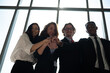 © Pataradon - Group of diversity business people hands stack together at the office.