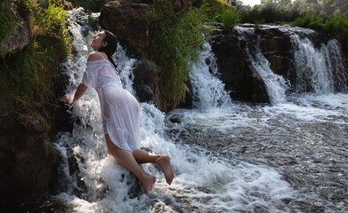 Wall Mural - Seminude woman in a waterfall