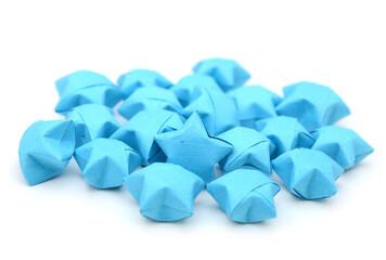 Wall Mural - Blue origami lucky stars on white
