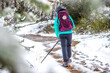 Girl Pilgrim Hiker Walking in Frosty Snow Mountain Forest on the Way of St James Pilgrimage Camino de Santiago