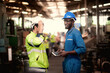 © pornchai - Group of industrial worker team and foreman  consist of Technicians, Engineers is discussing and working with many equipment and machine in Industry plant.