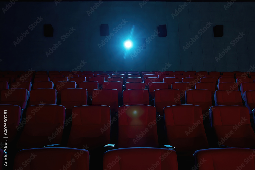 Interior of movie theater with empty red seats and projector Stock ...