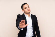 Asian Business Man Isolated On Beige Background Making Stop Gesture With Her Hand