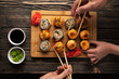 family eating sushi top view